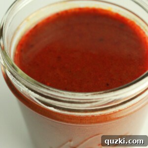 Signature Red Enchilada Sauce 8 A bowl of rich red enchilada sauce