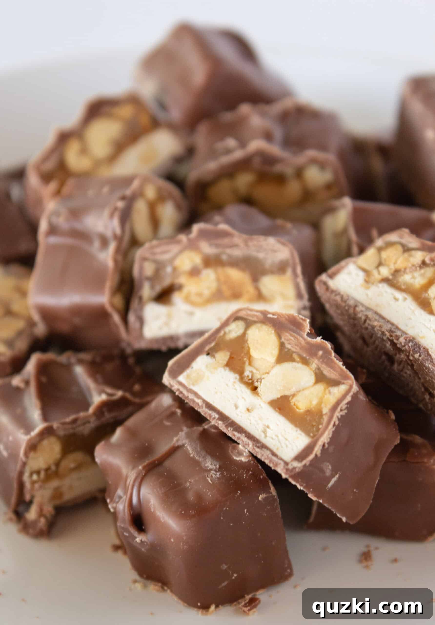 Ultimate Snickers Cookie Cups 6 Snickers candy bars cut into small pieces, ready to be placed inside the cookie cups.