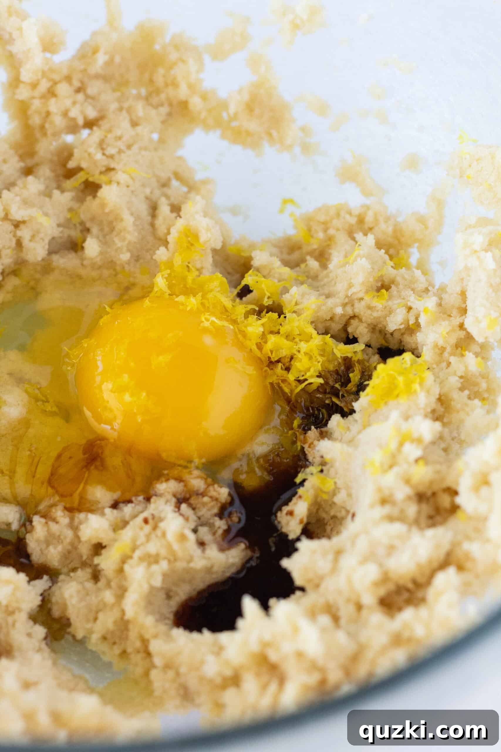 Effortless Lemon Blueberry Sour Cream Crumb Cake 4 The initial steps of making the Easy Lemon Blueberry Crumb Cake batter, combining butter and sugars until creamy.
