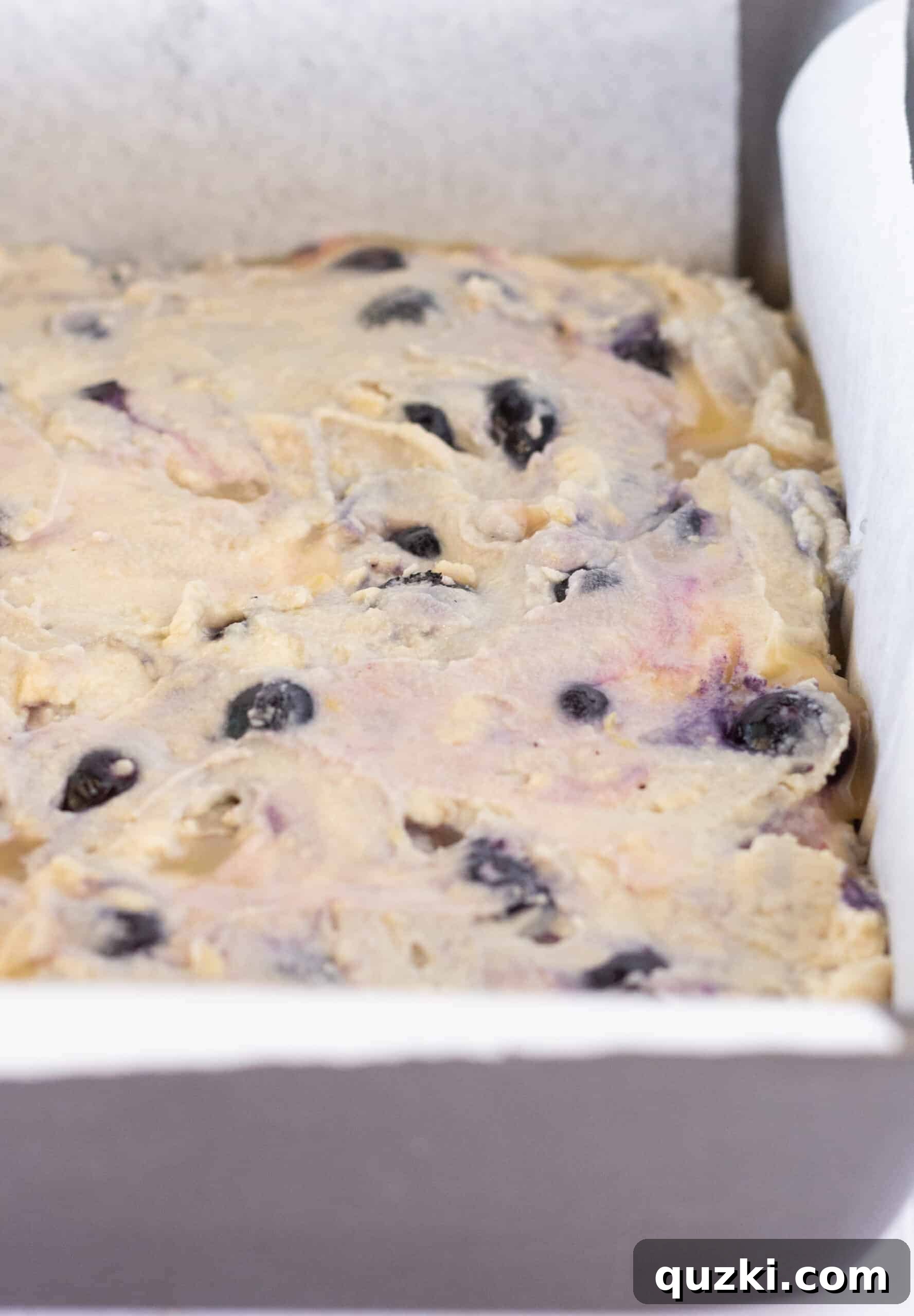 Effortless Lemon Blueberry Sour Cream Crumb Cake 10 Creating the crumb topping mixture for the lemon blueberry cake, ensuring it's perfectly crumbly.