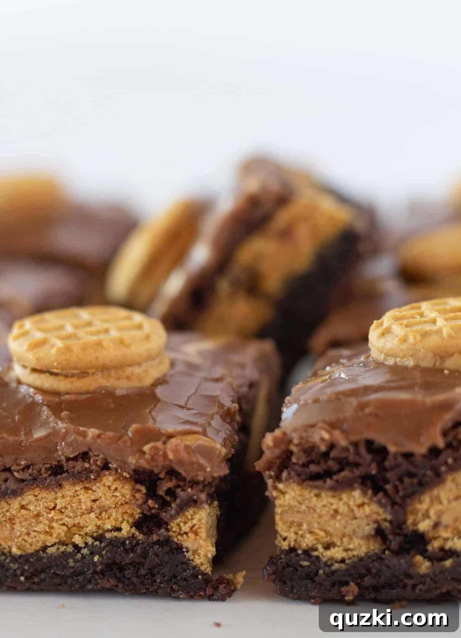 Easy Nutter Butter Brownies arranged artfully on a white serving tray, ready to impress guests.
