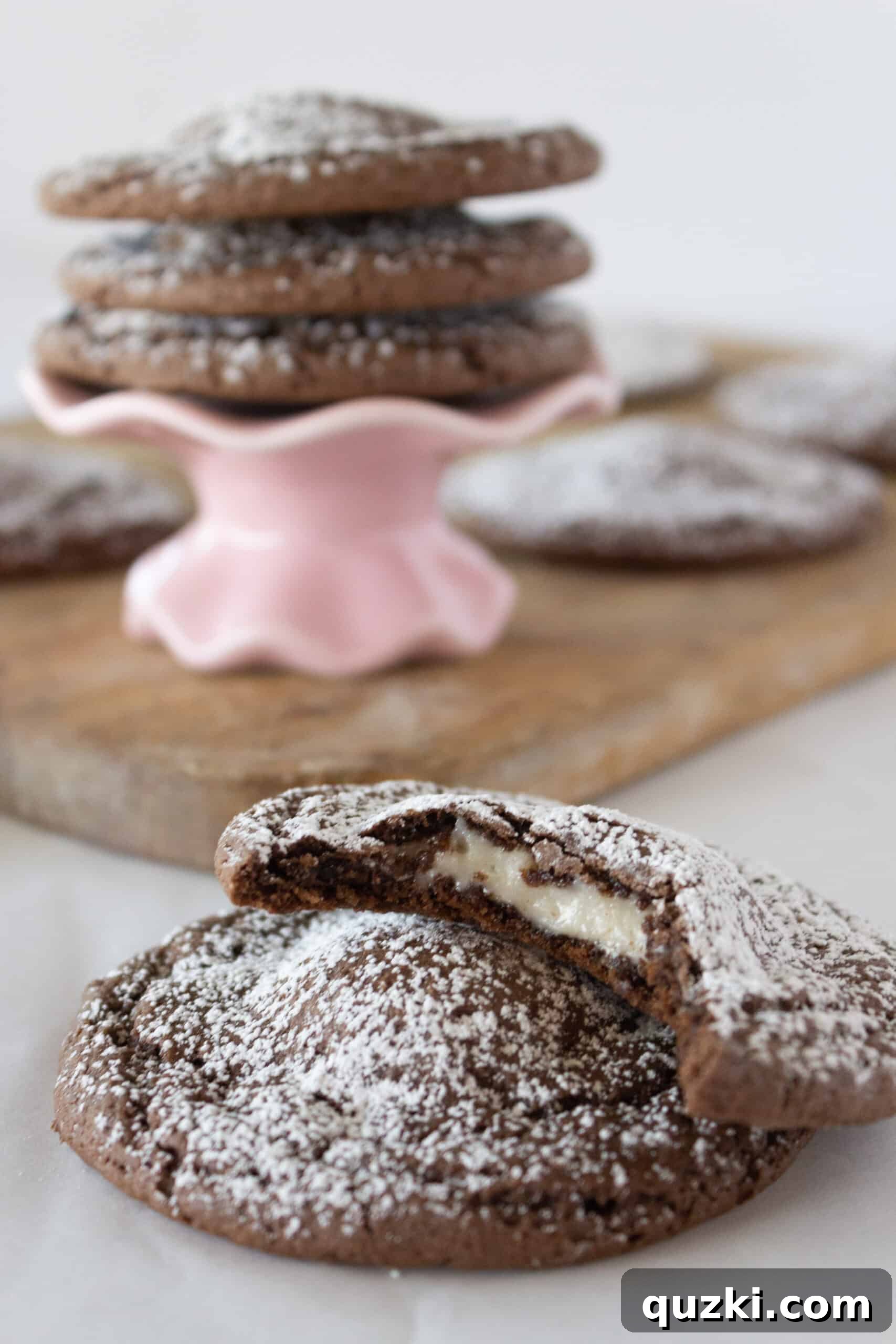 Cake Mix Chocolate Cheesecake Cookies 3 Close-up of a tray of freshly baked Chocolate Cheesecake Cookies, highlighting the smooth chocolate exterior and inviting texture.