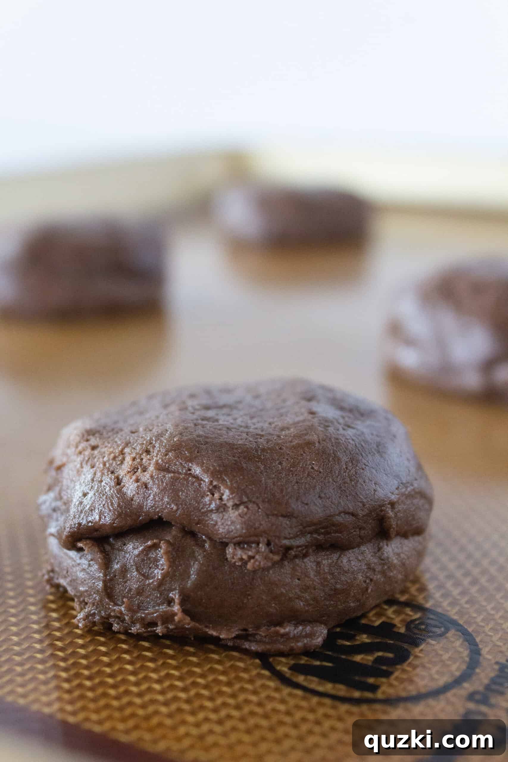 Cake Mix Chocolate Cheesecake Cookies 9 Skillfully sealing the chocolate cookie dough around the cheesecake filling to create a smooth, perfectly shaped cookie.