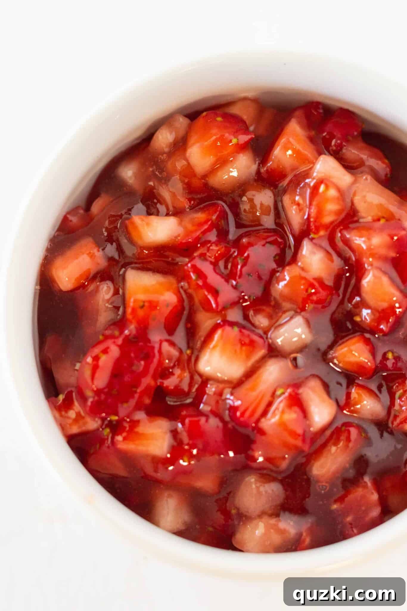 Decadent Strawberry Cream Cheese Pastries 11 A bowl of mixed fresh strawberries and jam, ready to be spooned onto the pastry bites.