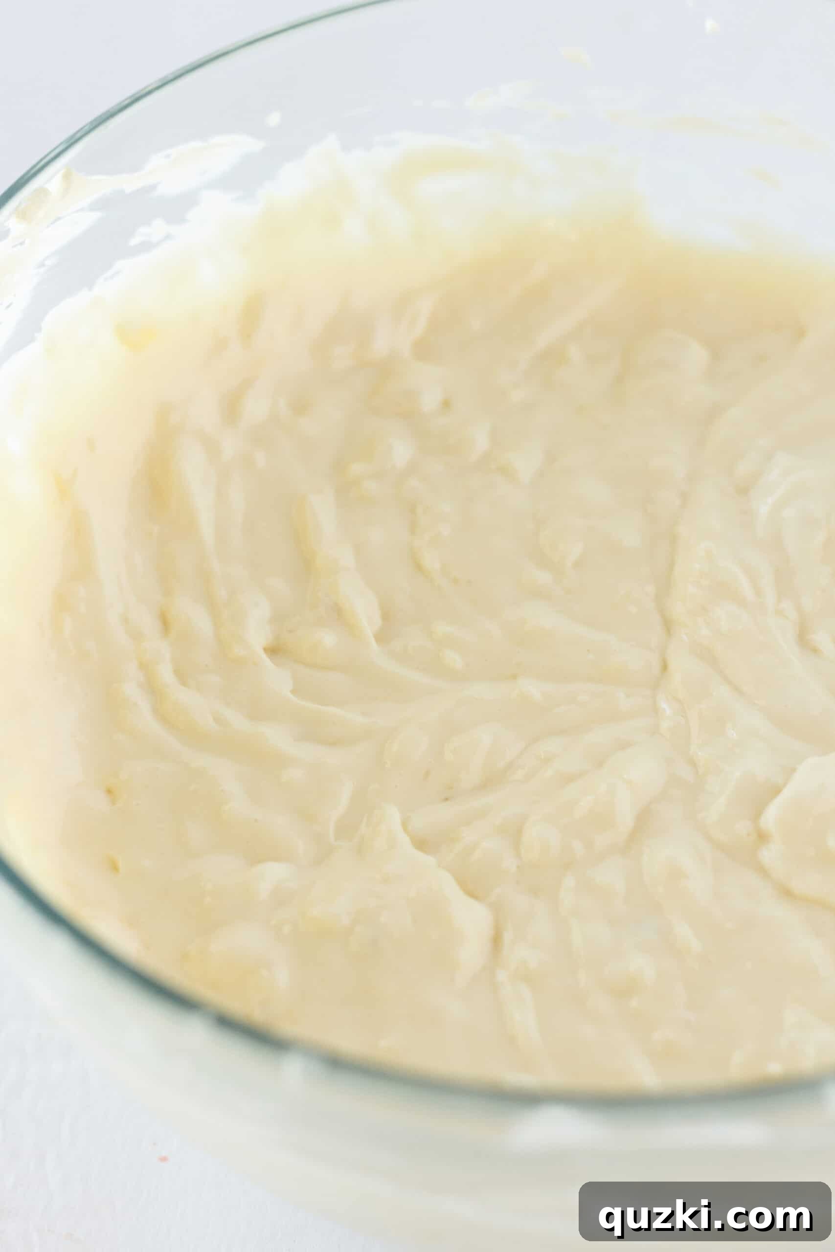 Island Escape No-Bake Cheesecake 6 Close-up view of the creamy, thick consistency of the Pina Colada cheesecake filling before it's combined with whipped topping.