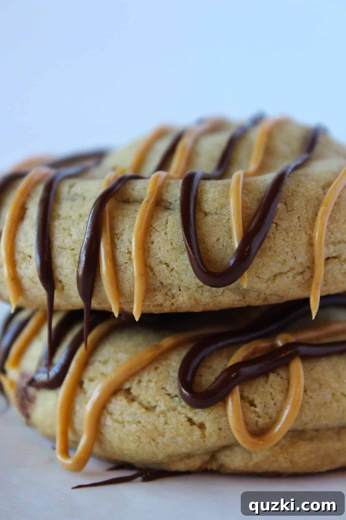 Ultimate Reese's Peanut Butter Cup Cookies 16 Multiple Reese's Peanut Butter Cup Stuffed Cookies artfully stacked on a plate, showcasing their inviting texture
