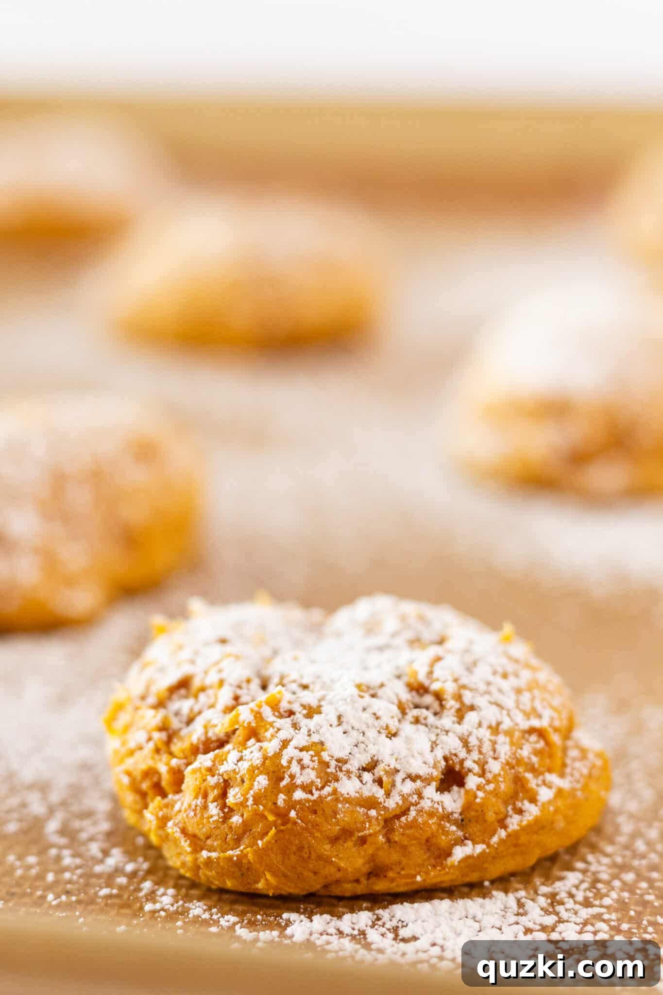 Finished Pumpkin Cream Cheese Cookies, generously dusted with powdered sugar and ready to serve.