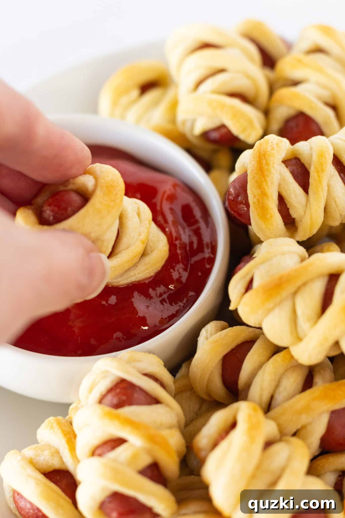 Frightfully Good Mummy Franks 3 Ingredients for Mini Mummy Hot Dogs: Little Smokies and crescent roll dough ready for preparation.