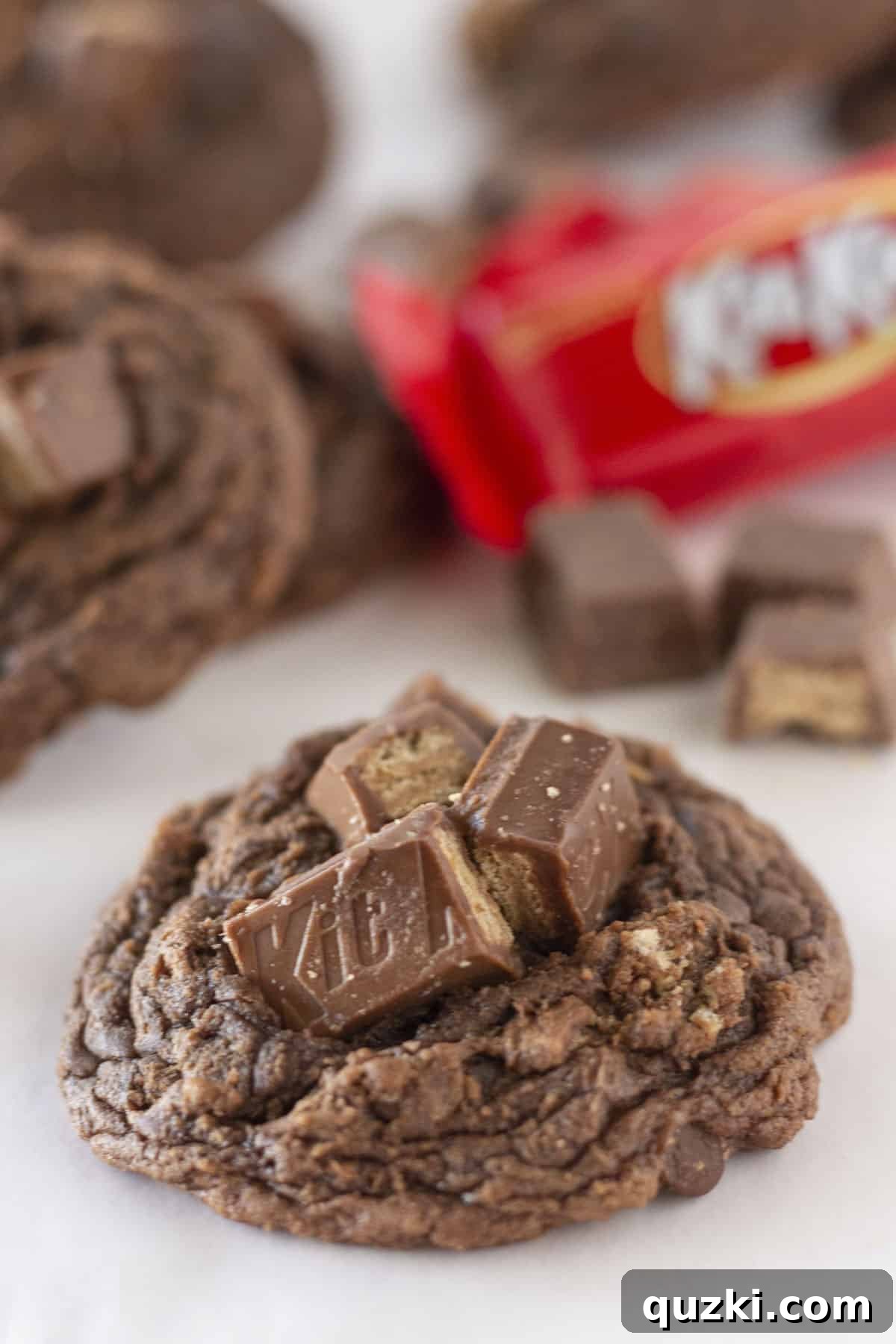 Irresistible Kit Kat Brownie Cookies arranged beautifully on a white tray, adorned with extra Kit Kat pieces on top.