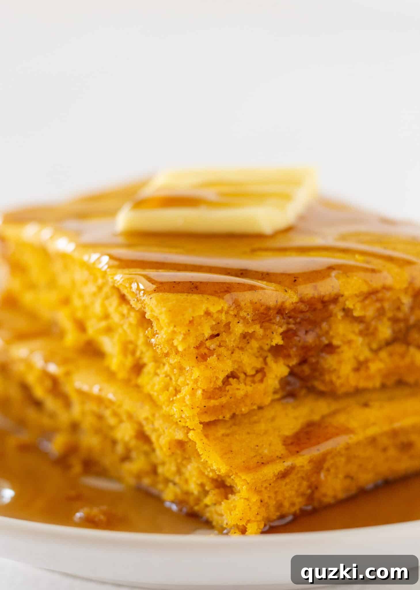 Effortless Sheet Pan Pumpkin Pancakes from Mix 6 Pumpkin Sheet Pan Pancakes squares cooling on a wire rack after baking, perfect for meal prepping.
