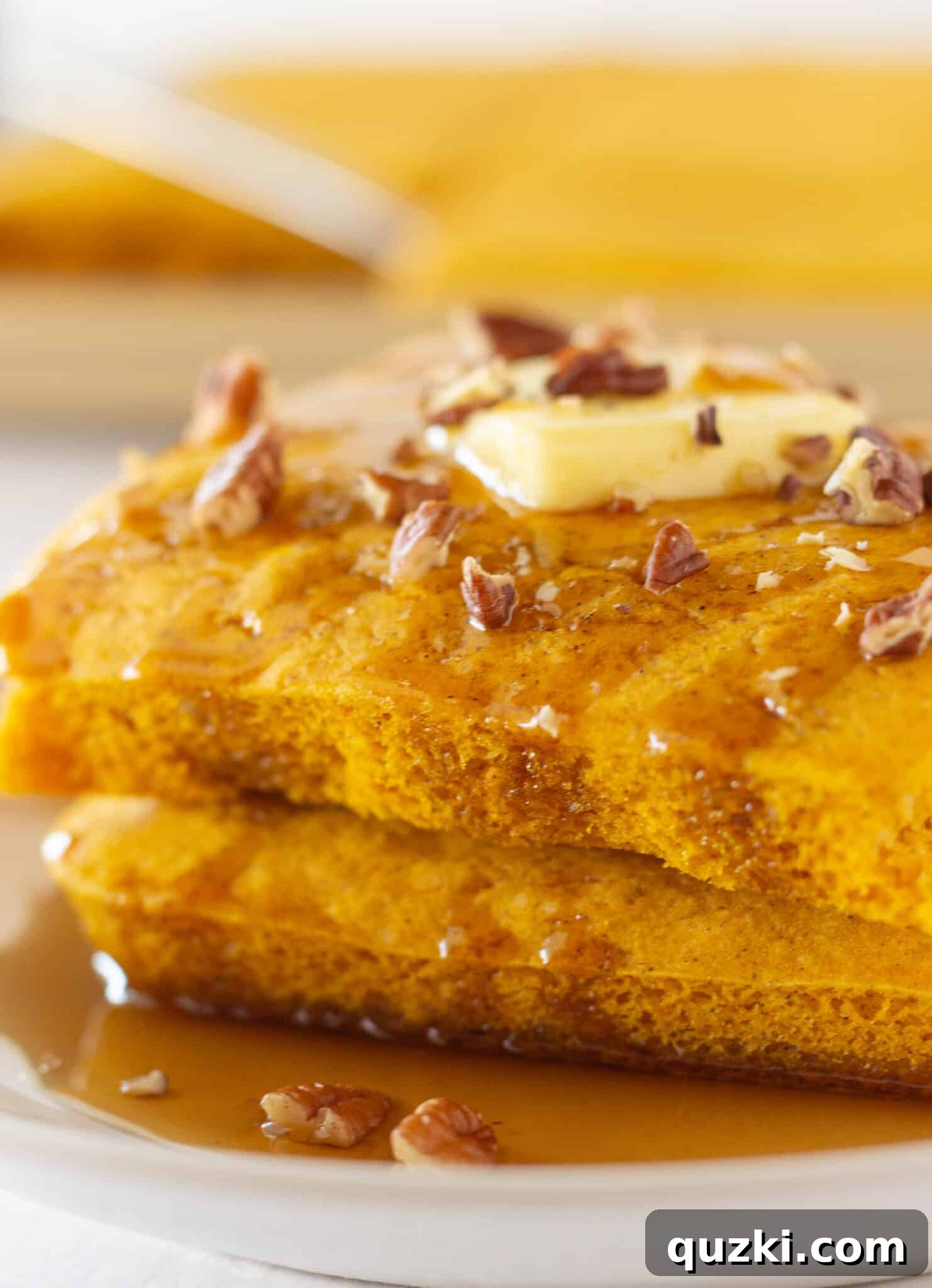 Effortless Sheet Pan Pumpkin Pancakes from Mix 7 A large rectangular Pumpkin Sheet Pan Pancake, beautifully baked and ready for cutting, showcasing its golden perfection.