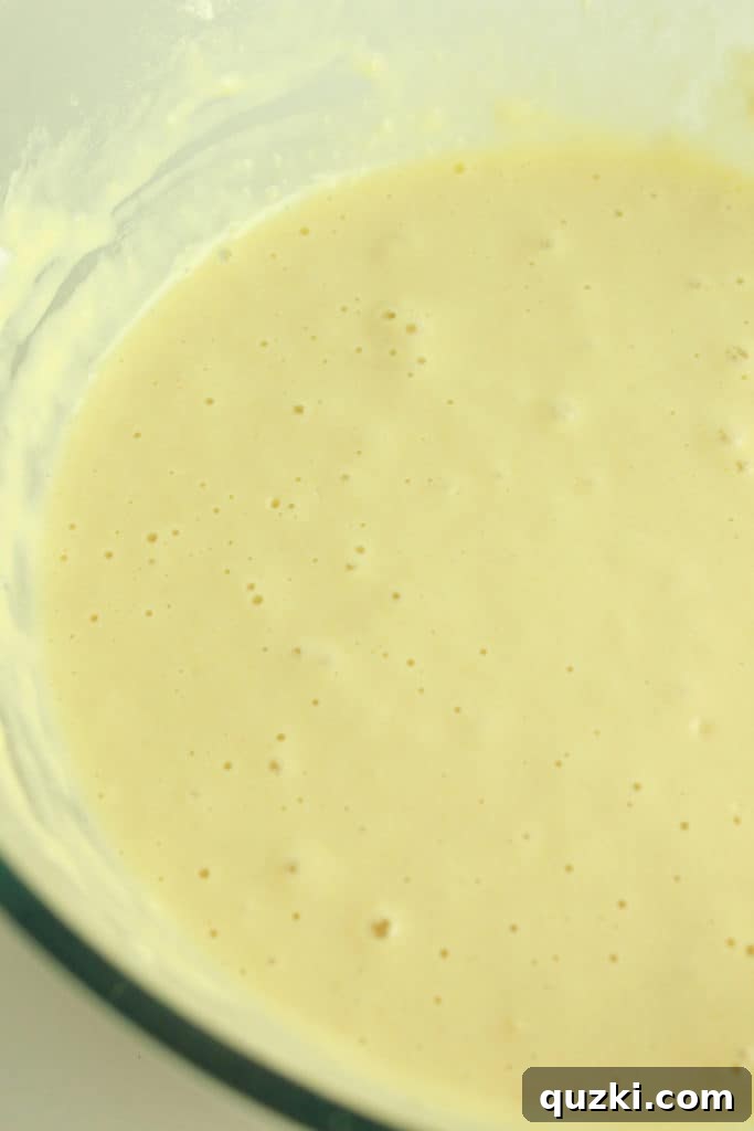 Pouring colorful pancake batter onto a hot griddle