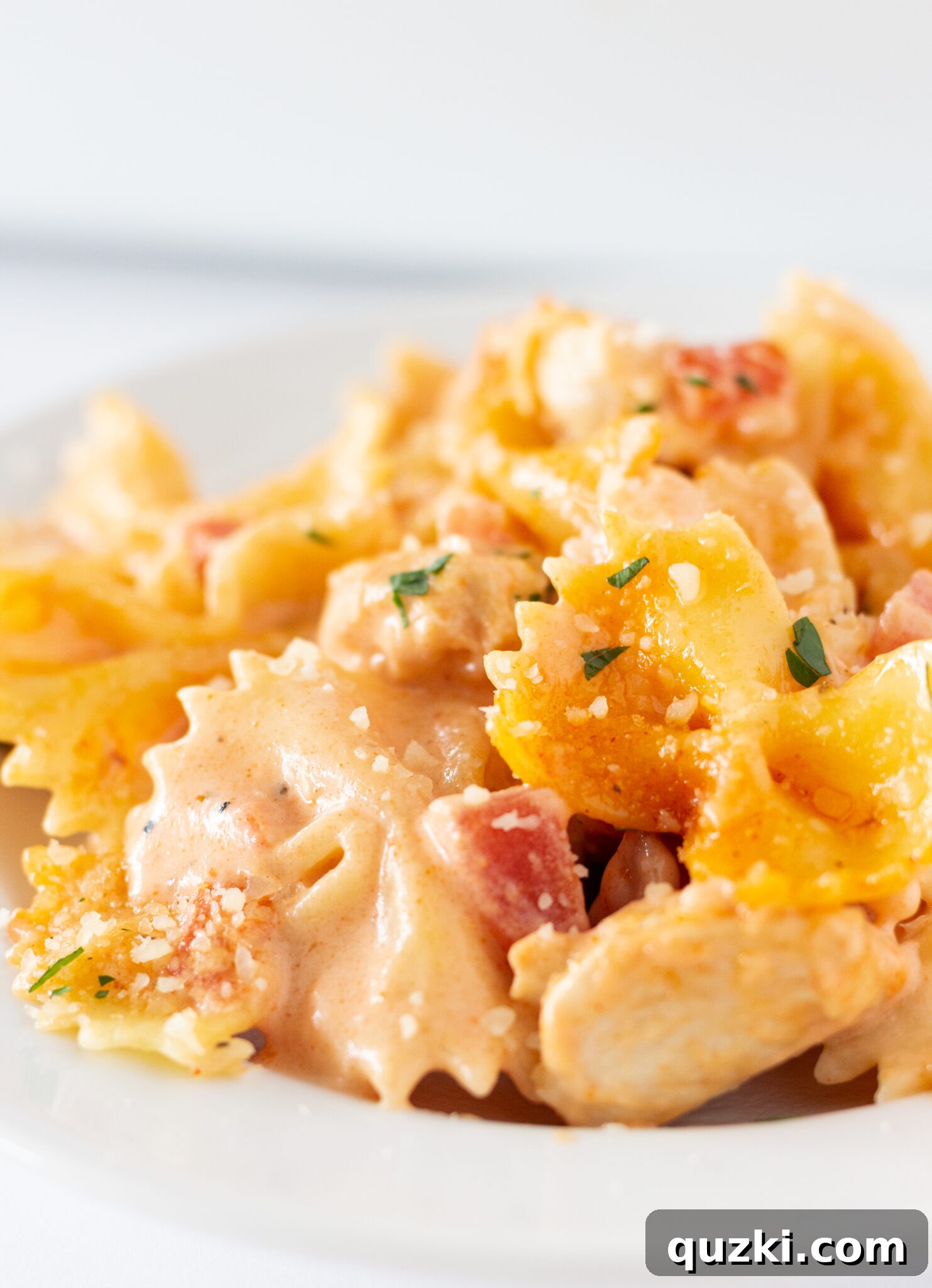 A generous serving of Easy Cajun Chicken Pasta Casserole, rich with creamy sauce and golden cheese, served on a plate and ready to enjoy.