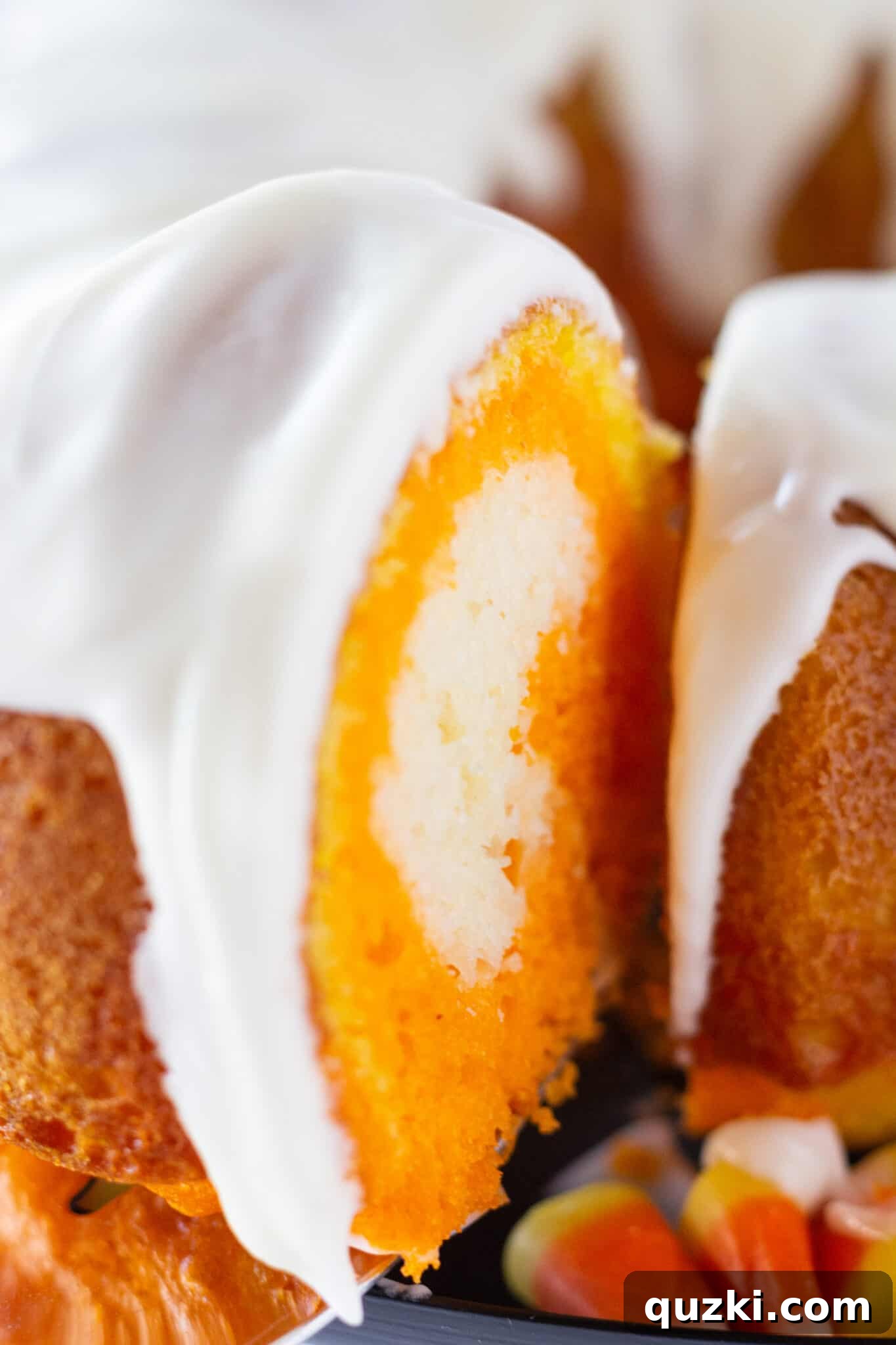7 Terrifyingly Tasty and Effortless Halloween Treats for Your Party 4 Easy Candy Corn Bundt Cake, made with a cake mix, showcasing vibrant layers of white, orange, and yellow, perfect as a Halloween party dessert.