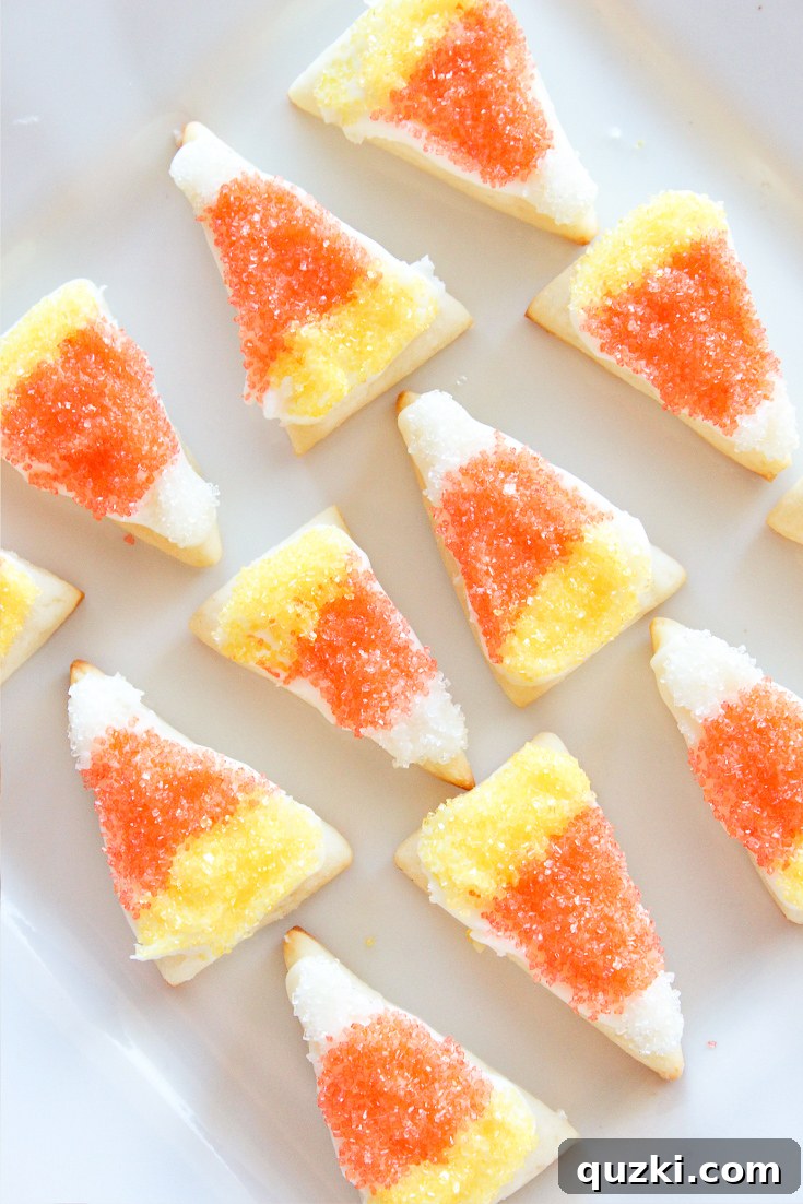 7 Terrifyingly Tasty and Effortless Halloween Treats for Your Party 7 Easy Candy Corn Sugar Cookie Bites, made with cream cheese sugar cookies, featuring festive white, orange, and yellow colors, ideal for simple Halloween party treats.