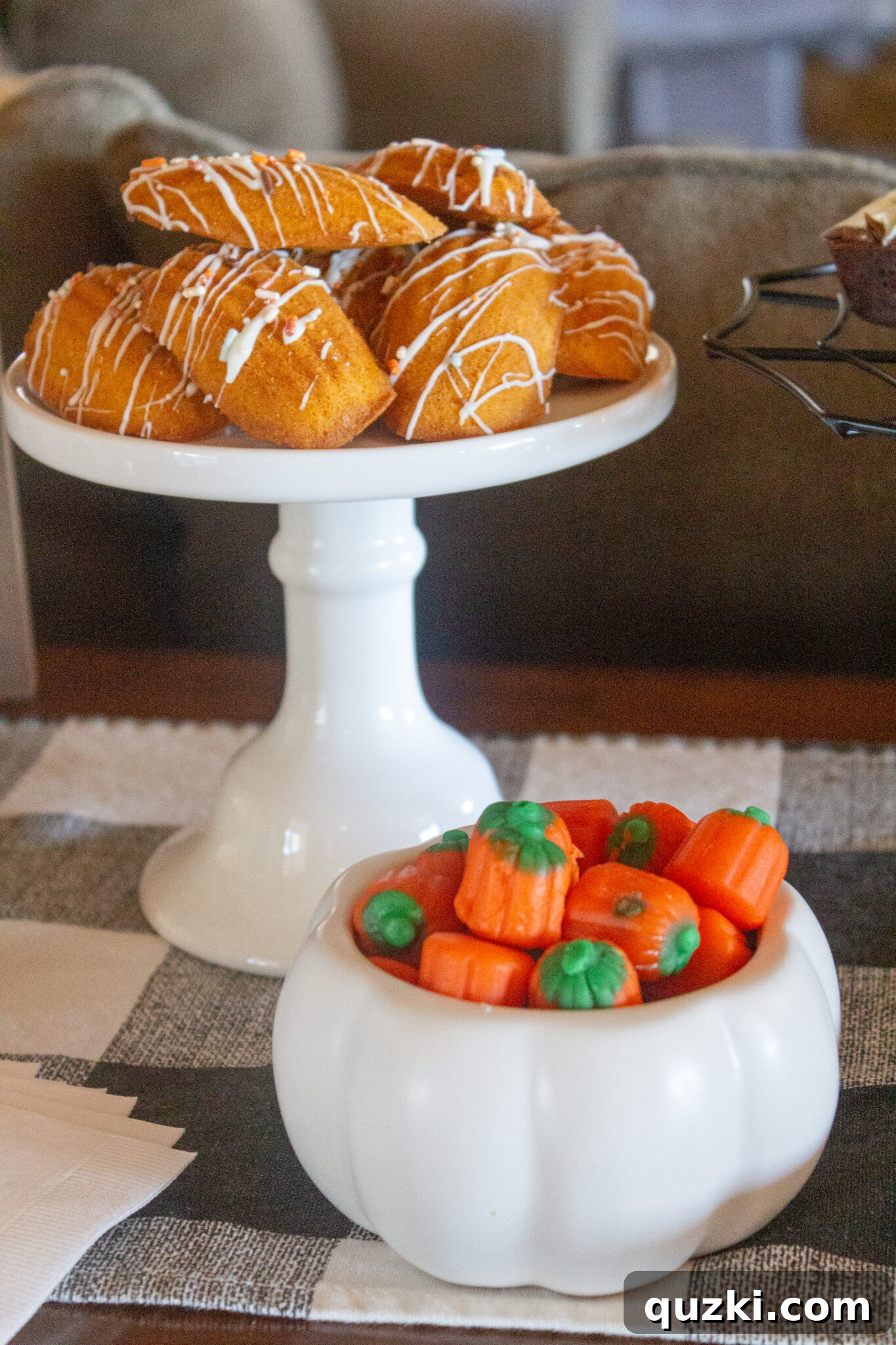 Spooktacular Halloween Dessert Display: 15 Creative and Creepy Treats 9 An array of Halloween desserts artfully arranged on plates and in bowls, featuring a mix of baked goods and fun candies.