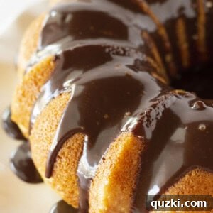 Looking at a Boston Cream Pie Poke Cake with Chocolate Ganache.