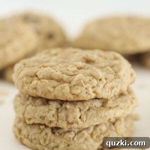 Three cake mix oatmeal cookies stacked on each other, showcasing their soft texture.
