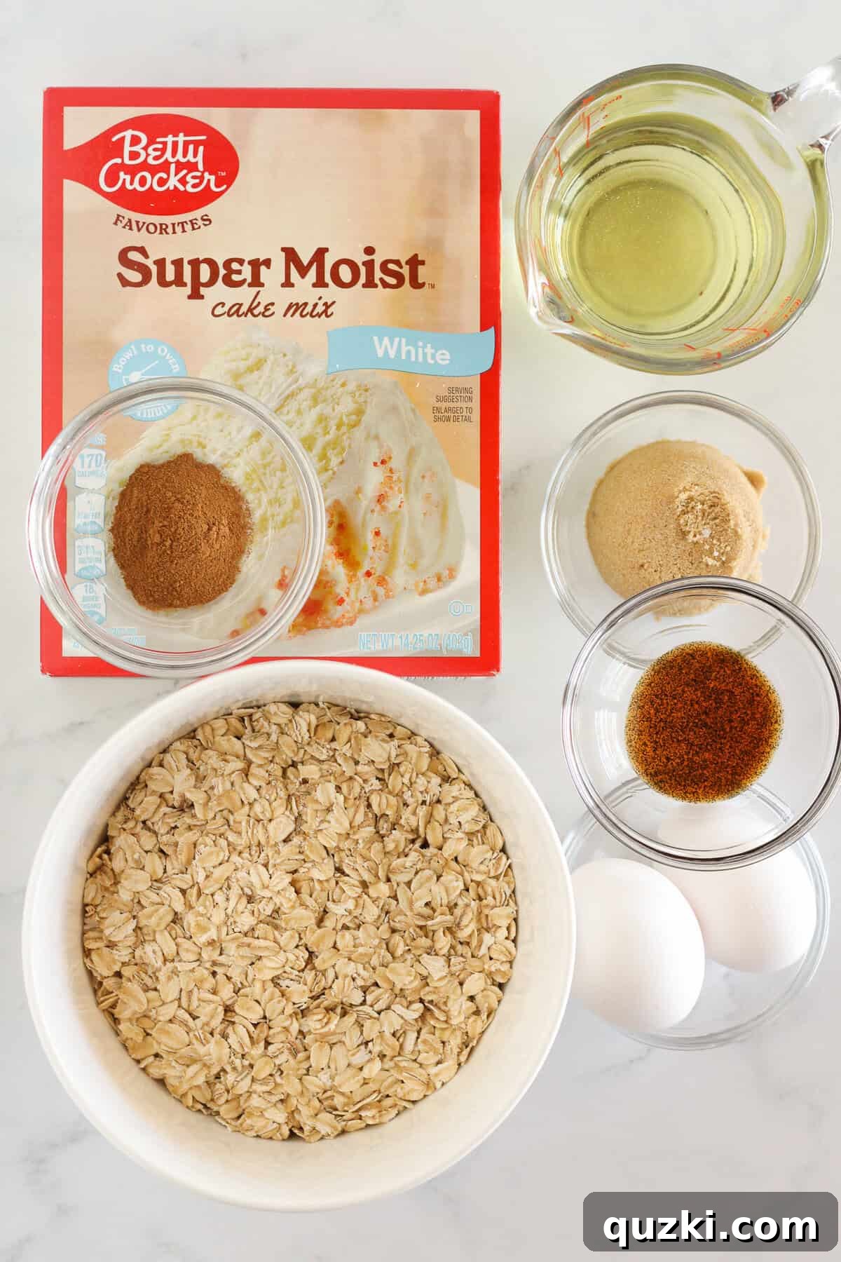 All the essential ingredients neatly laid out on a table, ready to make a batch of delicious cake mix oatmeal cookies.