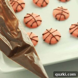 Slam Dunk Cupcake Toppers 8 Close-up of a basketball cupcake topper, showing the texture and detail on the wafer and almond bark.