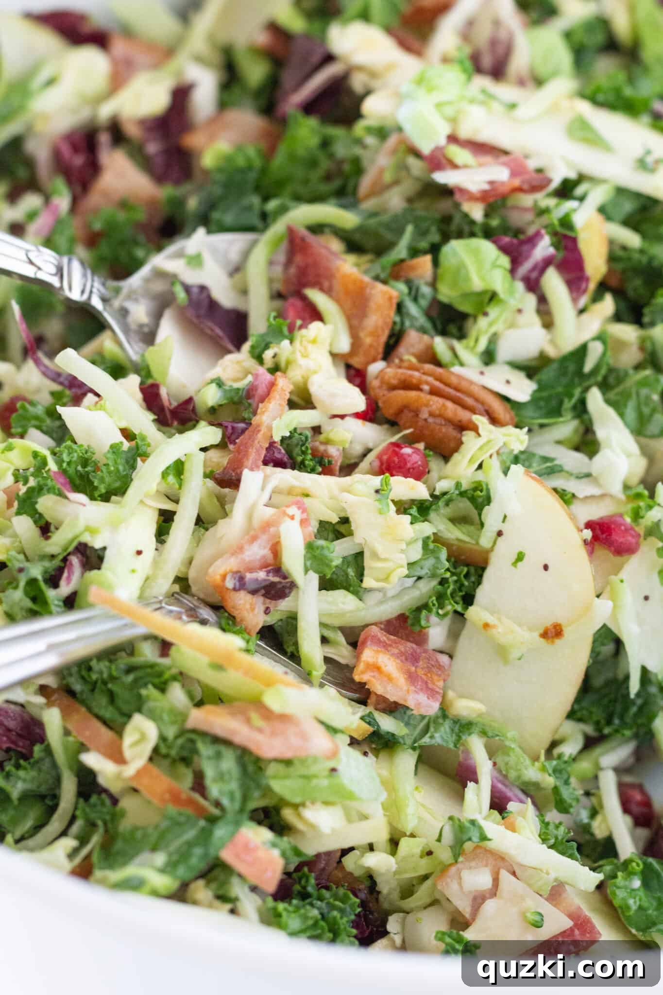 Crisp Autumn Apple Salad 5 An Easy Thanksgiving Harvest Salad Recipe with Apples, bacon, and pecans in a large white serving bowl.