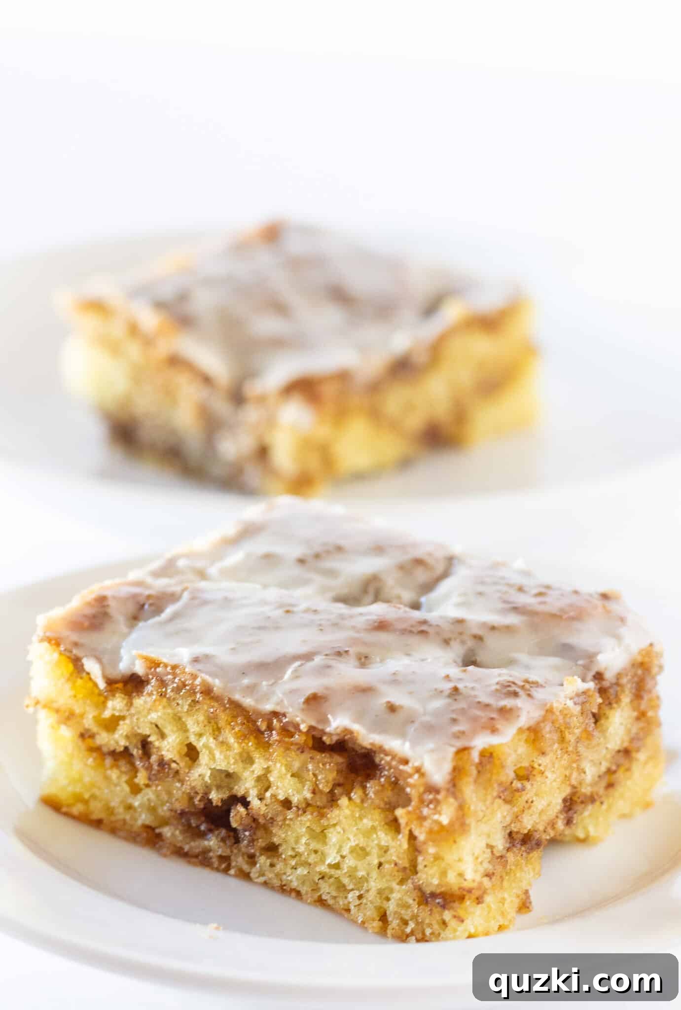 Effortless Cinnamon Roll Cake 7 Serving two generous slices of cinnamon roll cake that starts with a convenient cake mix.
