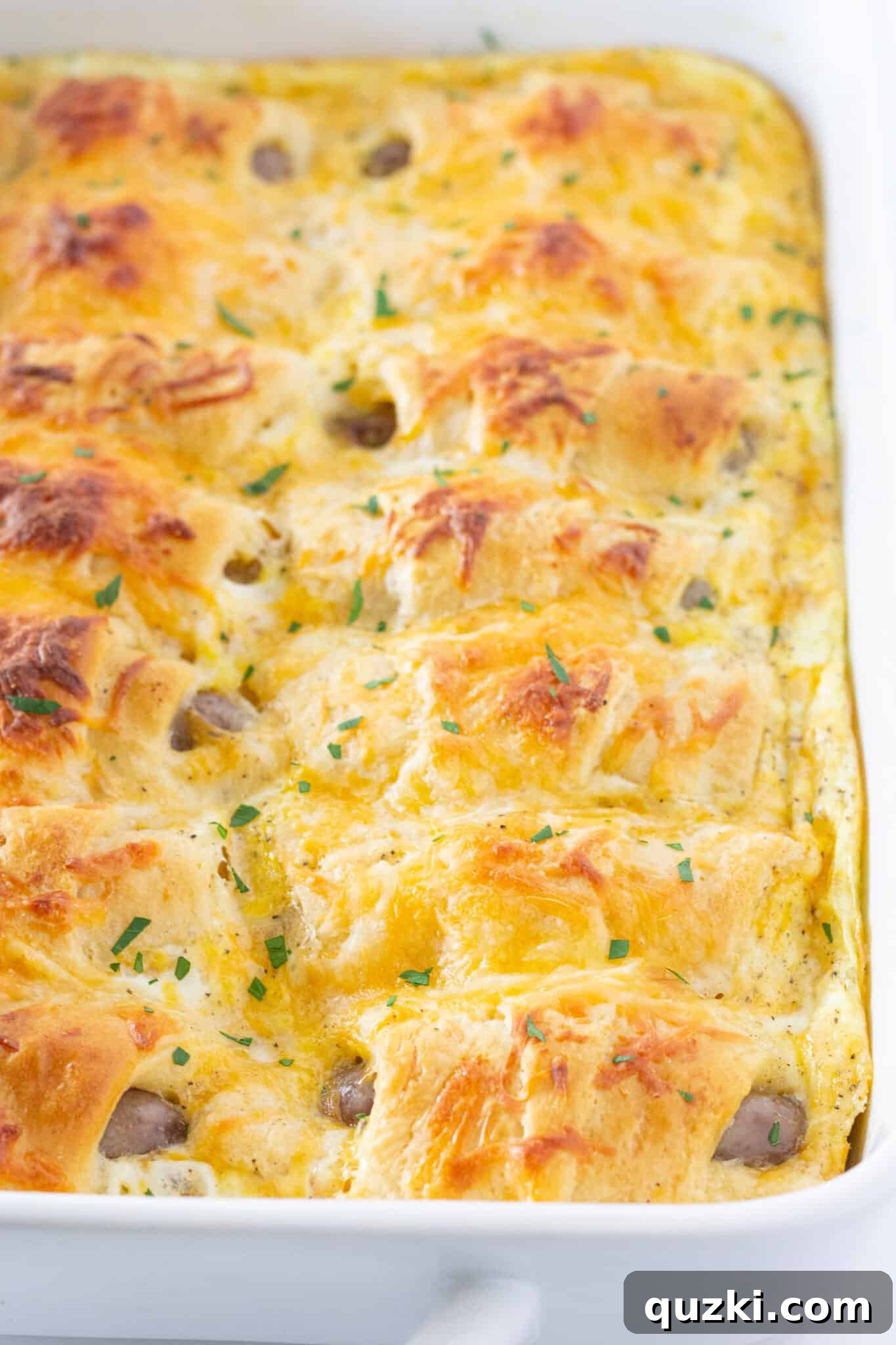 Ultimate Pigs in a Blanket Breakfast Casserole 7 The stunning Pigs in a Blanket Breakfast Casserole recipe, freshly removed from the oven, with a perfectly browned top.