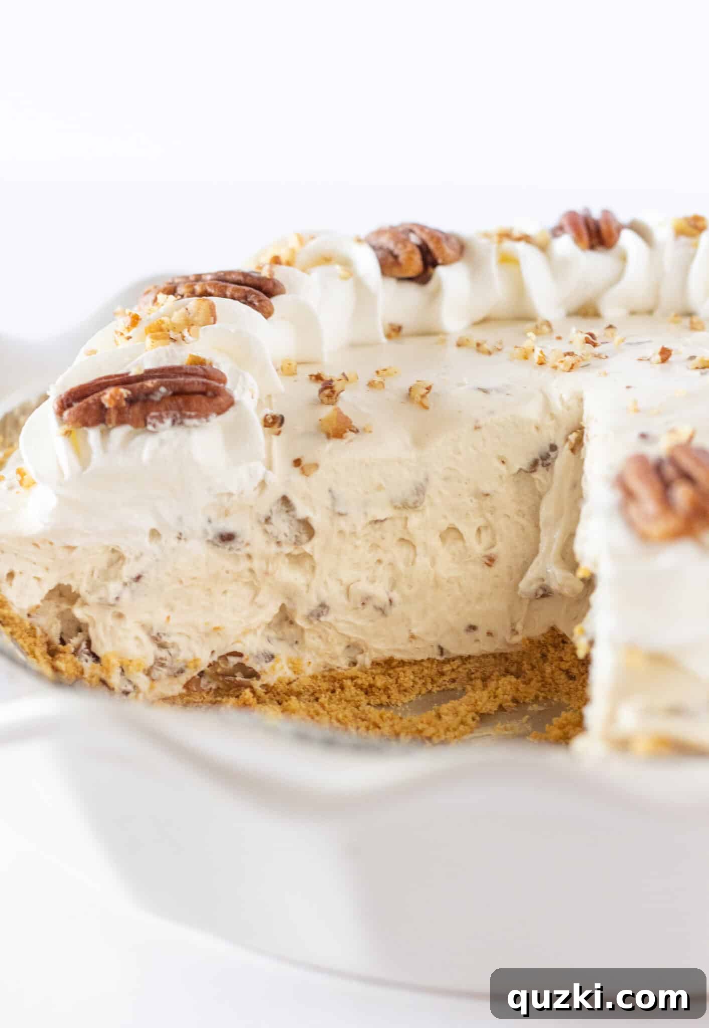 Thanksgiving's Easiest Butter Pecan Cream Pie with Cream Cheese 3 Serving an Easy Butter Pecan Cream Pie Recipe with Cream Cheese, ready for guests.