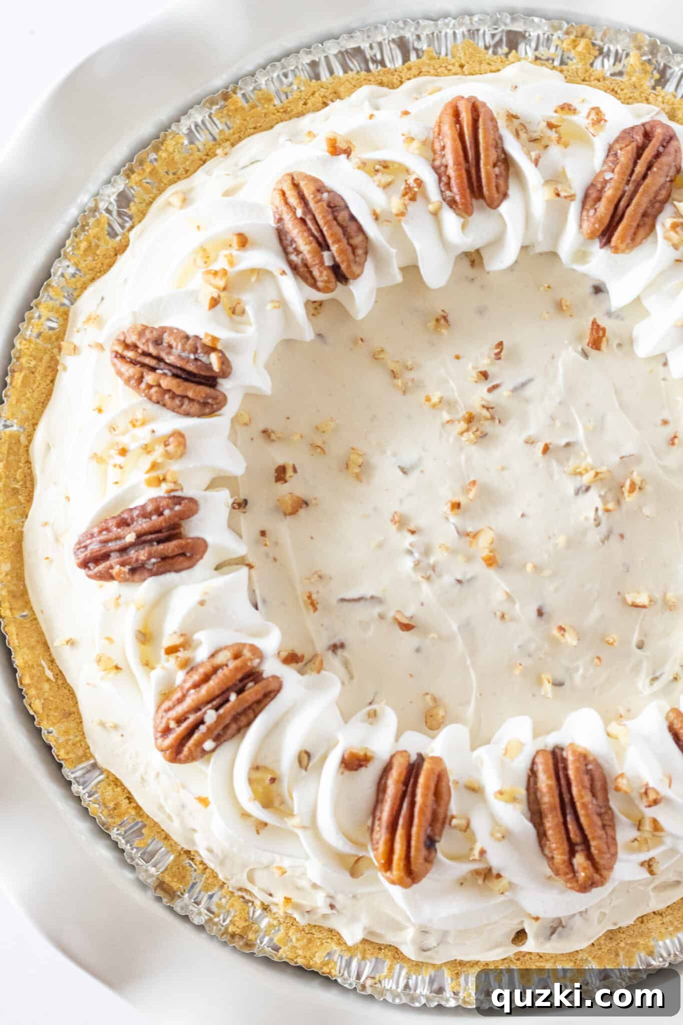 Thanksgiving's Easiest Butter Pecan Cream Pie with Cream Cheese 7 Easy Butter Pecan Cream Pie Recipe with Cream Cheese, showing a full pie ready for serving.