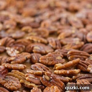 A perfectly toasted salted butter pecan, captured in a detailed close-up, highlighting its appealing texture and rich color.