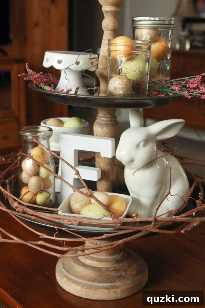 Hop into Easter Decor Ideas 2 Beautifully styled three-tier Emerson Stand from Magnolia Market for Easter with white and wood elements, speckled eggs, and mason jars. The stand features a mix of natural wood and dark metal.