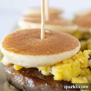 Sweet and Savory Pancake Sausage Egg Sliders 12 Close-up of a stack of Pancake Sausage and Egg Sliders, highlighting the delicious layers