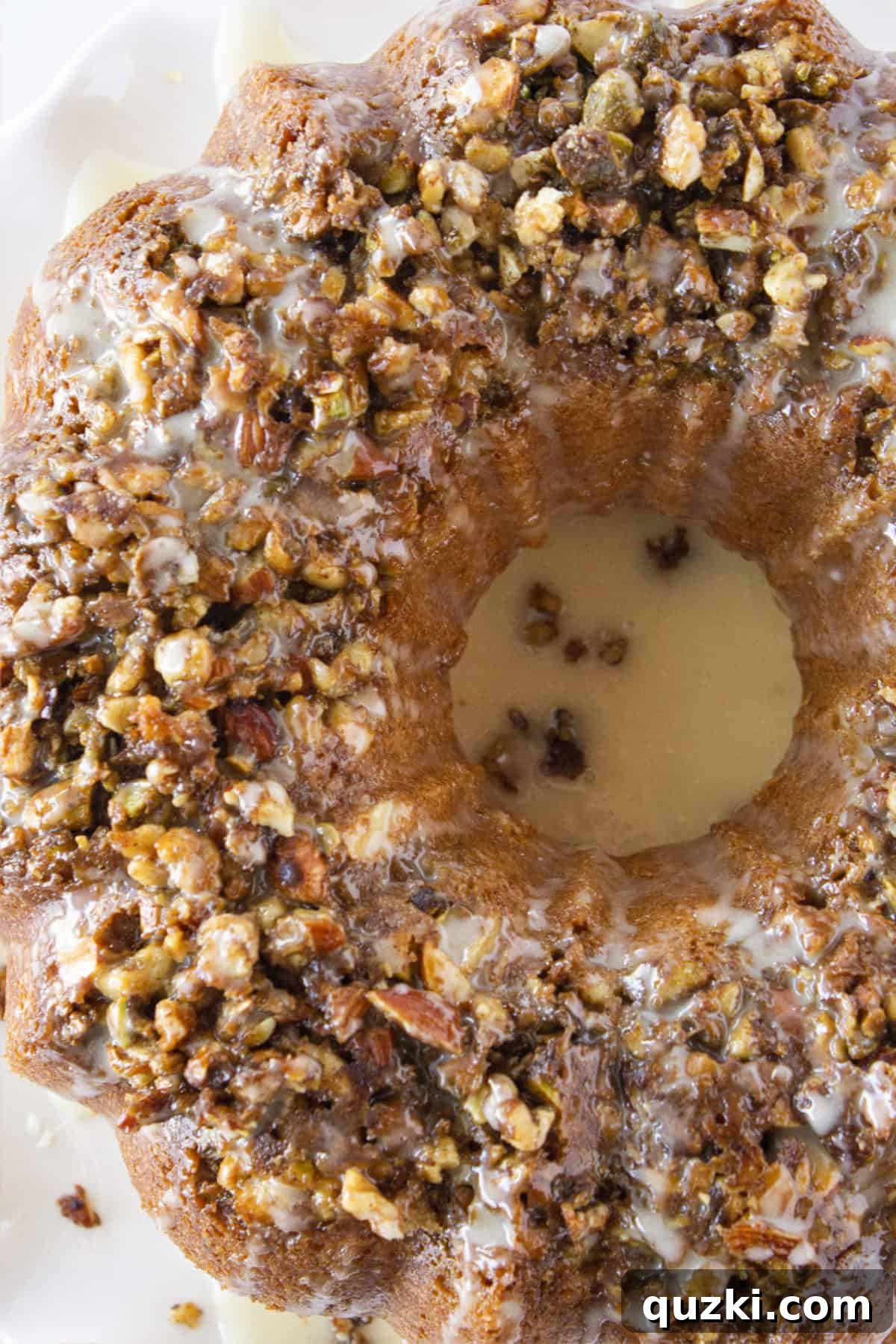 Stunning Christmas Bundt Cakes to Dazzle Your Guests 10 An overhead view of a beautifully glazed Baklava Bundt Cake, adorned with chopped nuts, ready to be enjoyed.