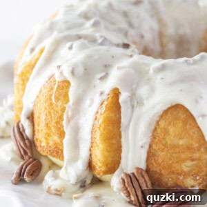 White Texas Sheet Bundt Cake Recipe 6 A beautifully baked white sheet cake in a bundt pan with a rich pecan frosting.