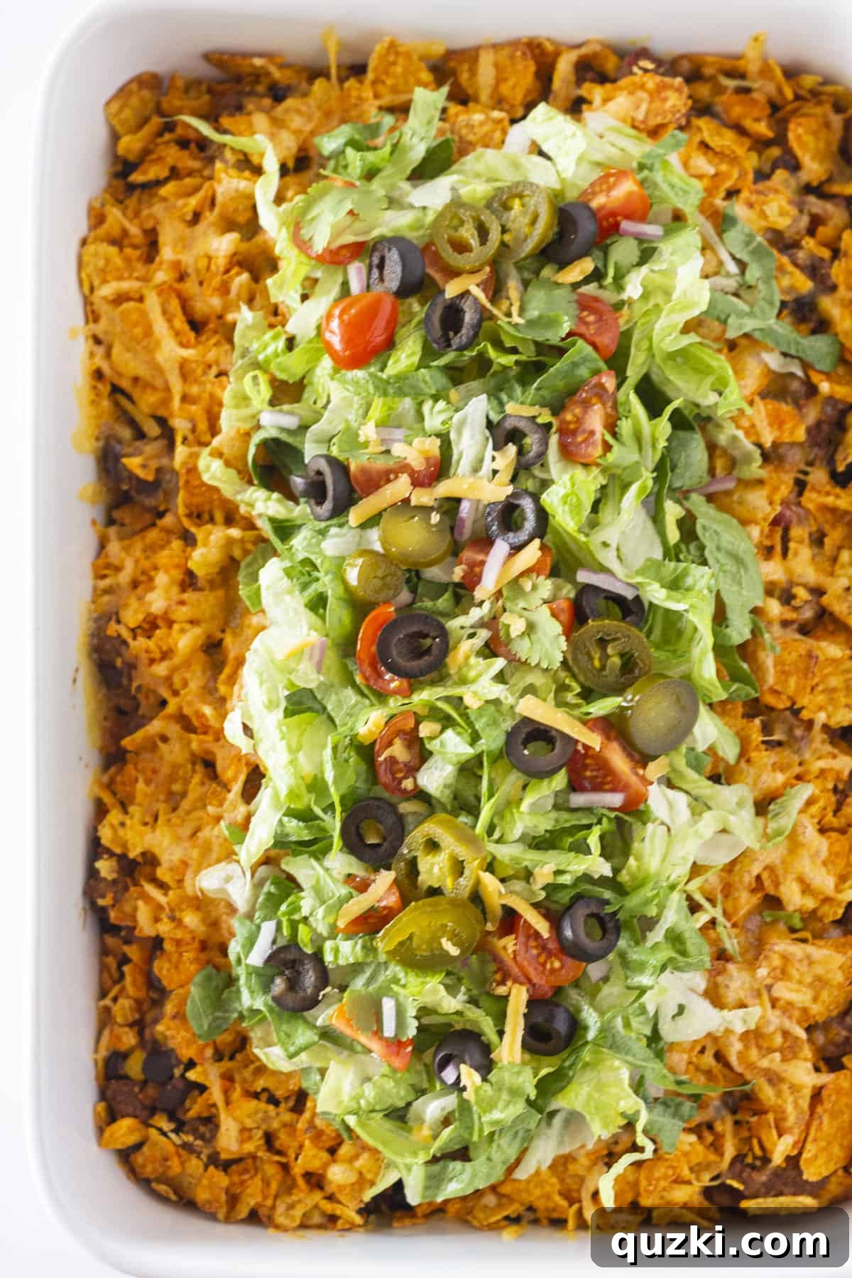 A top-down view of a freshly baked Doritos casserole, golden brown and bubbly, ready for serving.