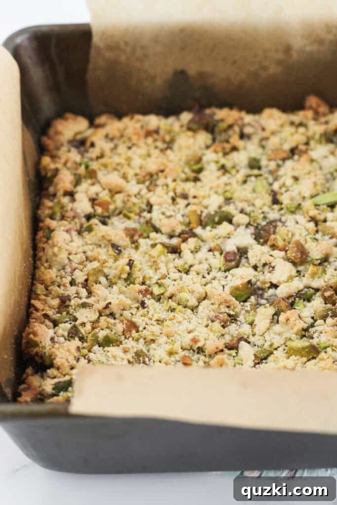 Freshly baked Blackberry Crumble Bars, golden brown and perfectly cooled in the pan, ready to be cut into squares.