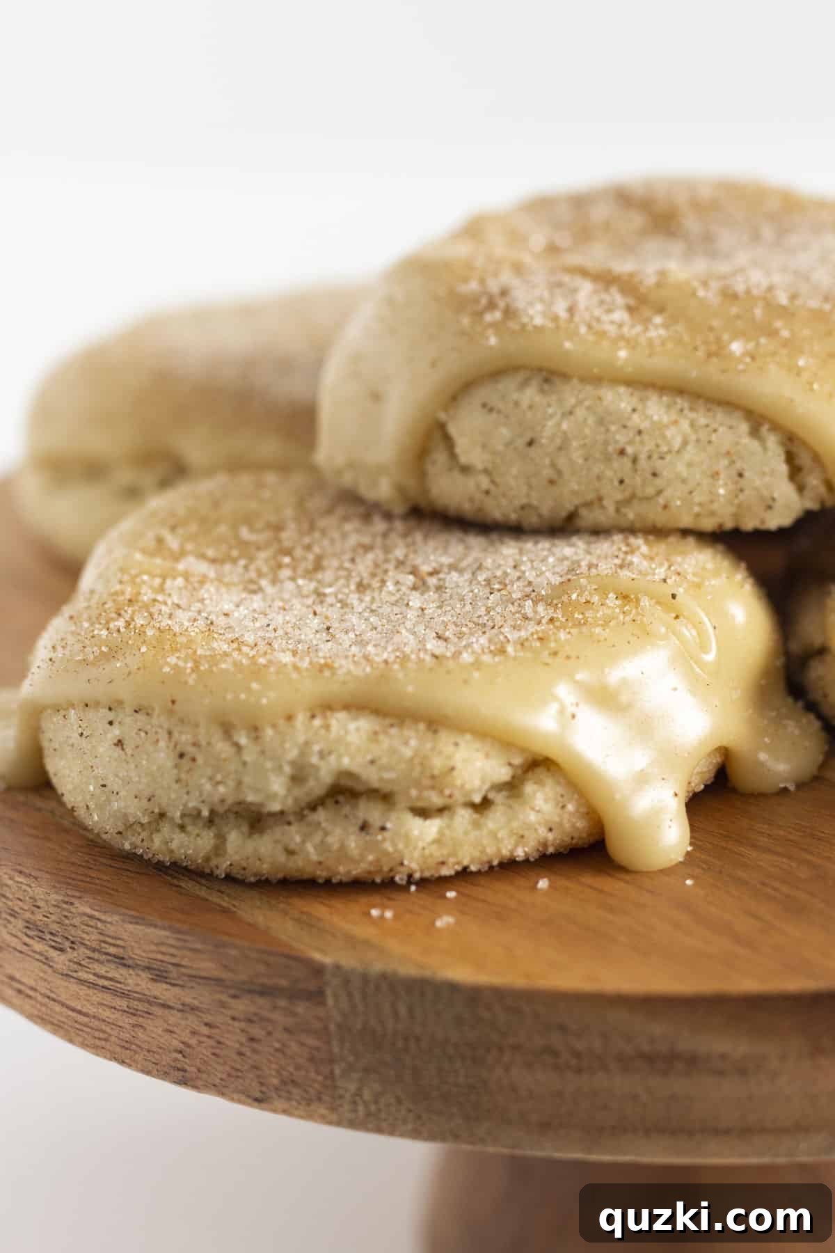 Ultimate Churro Cookies 2 A tray of freshly baked Easy Churro Cookies, dusted with cinnamon sugar and drizzled with caramel glaze.