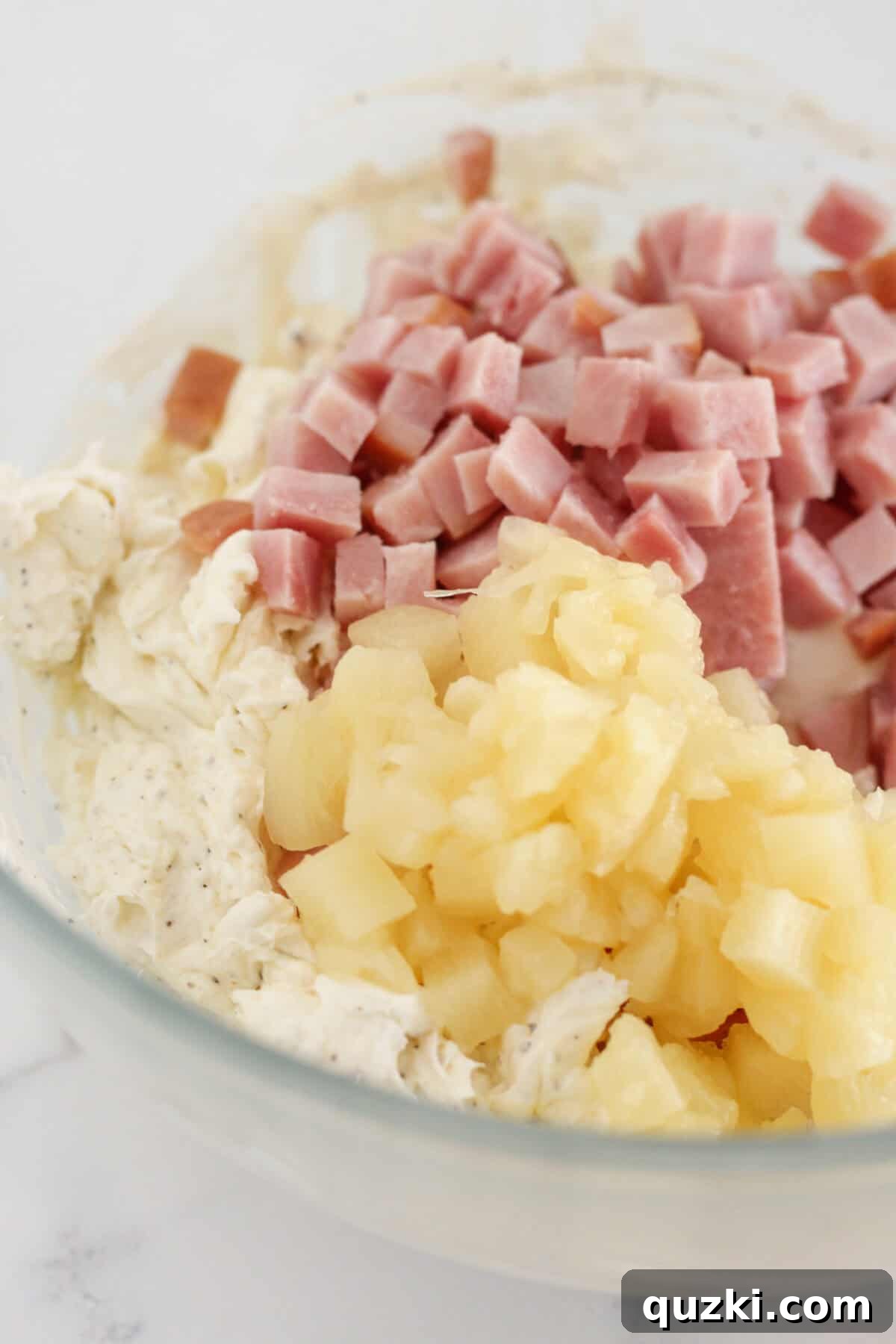 Effortless Hawaiian Ham Dip 5 Adding the pineapple and ham to the dip.