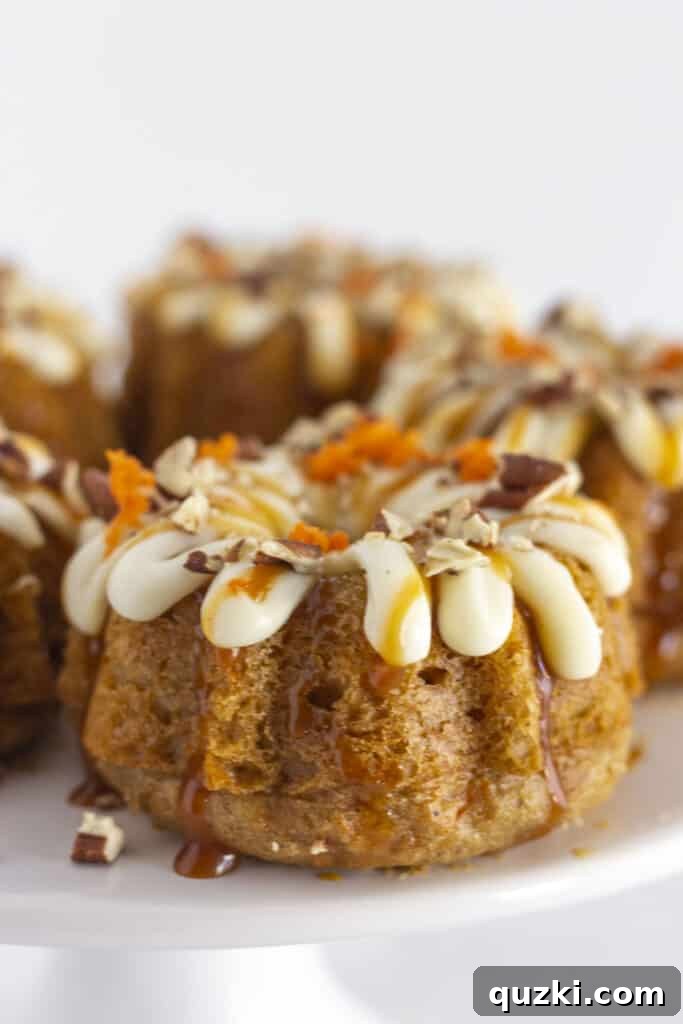 45 Simple & Stunning Cake Mix Bundt Cake Recipes 20 Mini carrot bundt cakes on a white cake plate.