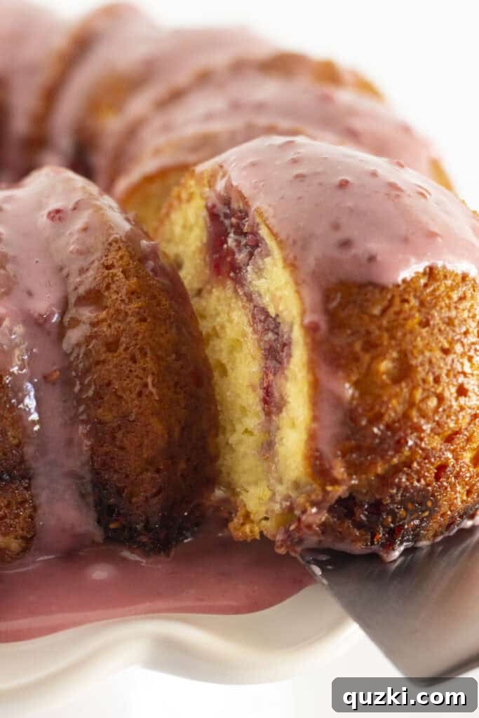 45 Simple & Stunning Cake Mix Bundt Cake Recipes 31 Serving a piece of raspberry lemonade bundt cake.