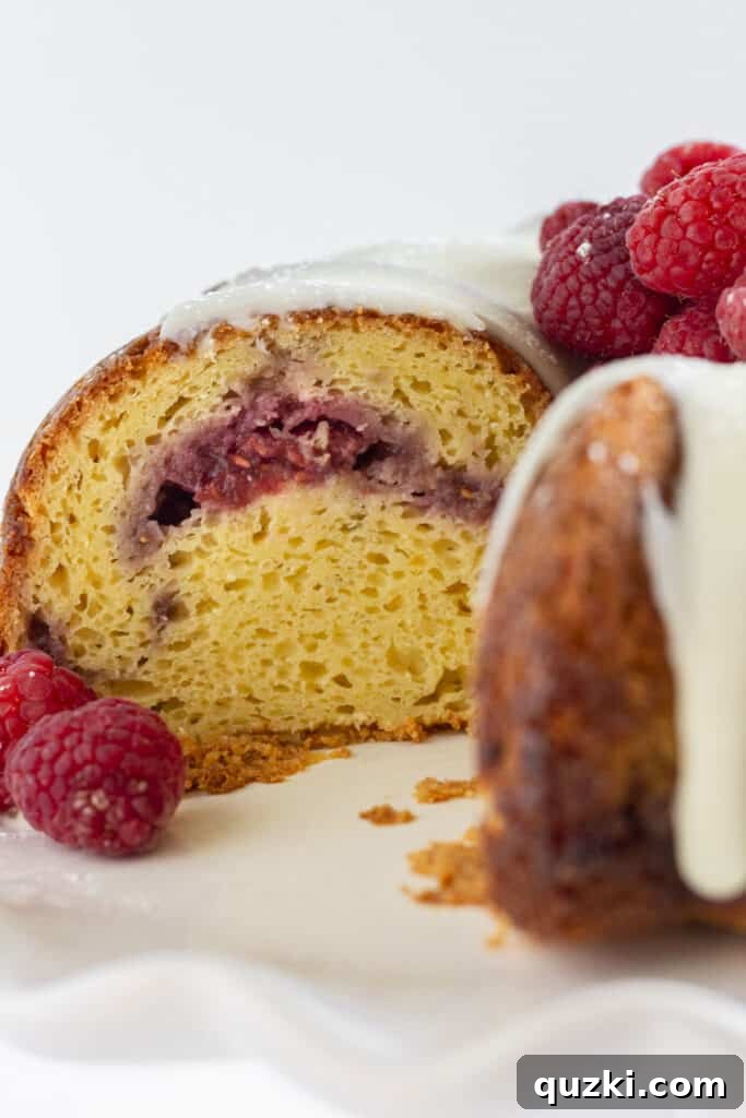 45 Simple & Stunning Cake Mix Bundt Cake Recipes 34 Looking into the inside of a white chocolate and raspberry cake.