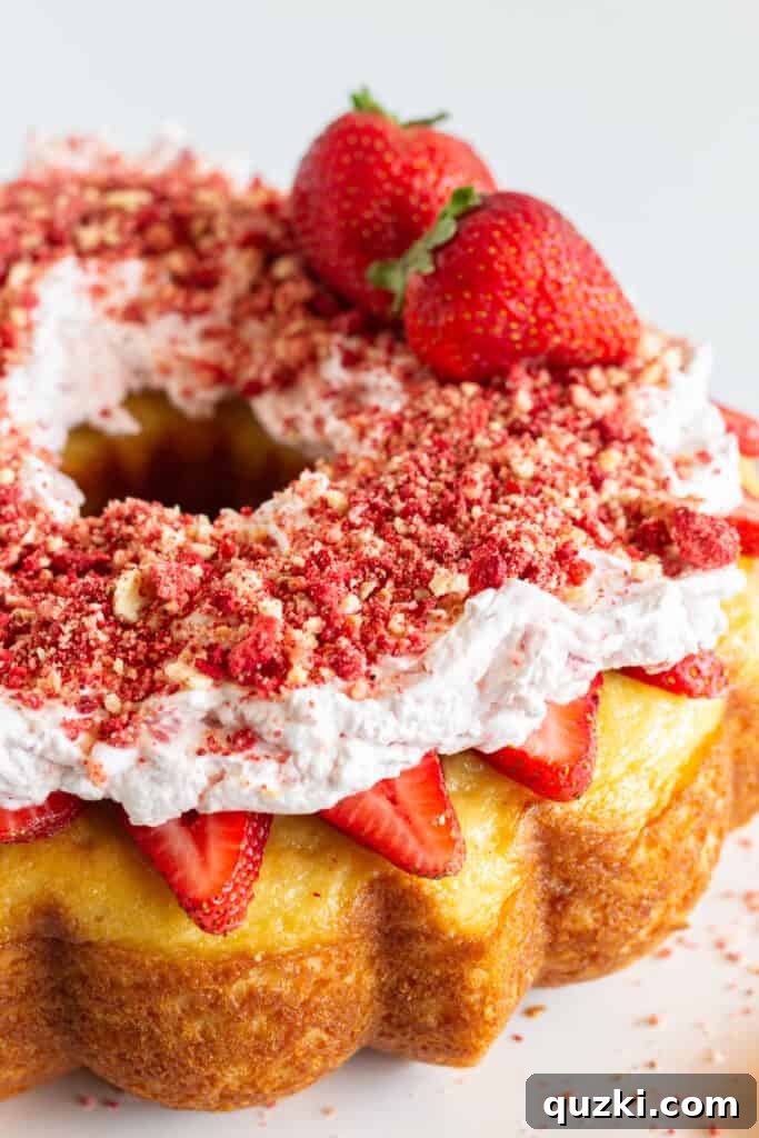 45 Simple & Stunning Cake Mix Bundt Cake Recipes 44 A finished strawberry crunch pound cake with fresh strawberries.