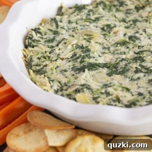 Serving spinach and artichoke dip without mayo and with crackers and carrots.