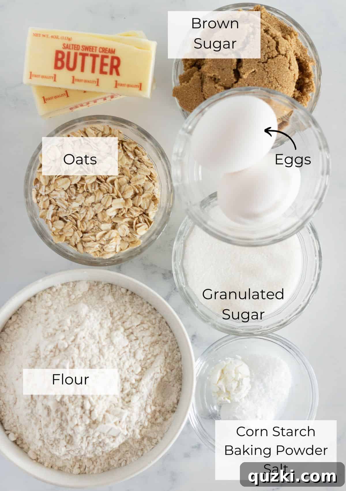 Rancher's Favorite Chewy Cowboy Cookies 3 All the dry and wet ingredients laid out to make Cowboy Cookies, including flour, sugars, eggs, vanilla, and butter cubes.