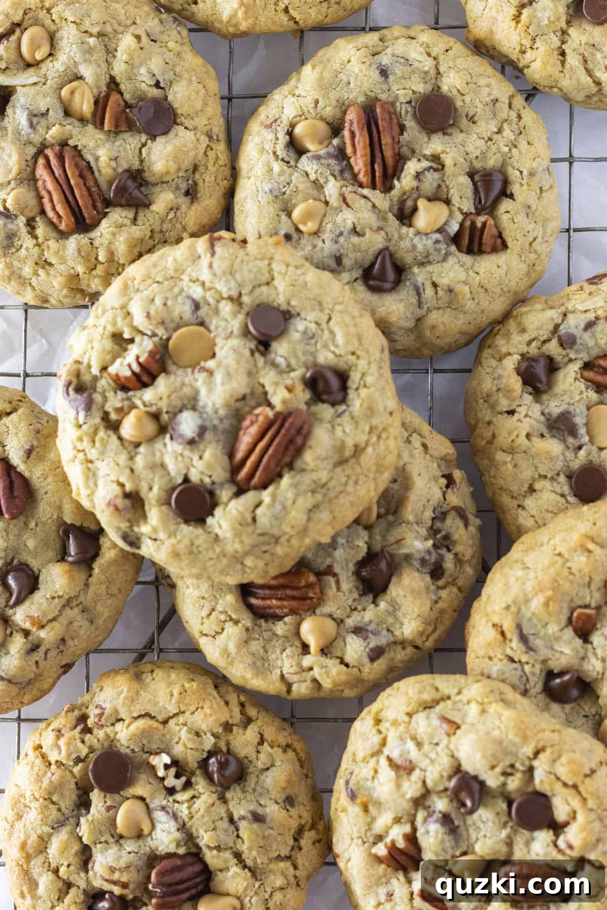 Rancher's Favorite Chewy Cowboy Cookies 8 A close-up shot of baked Cowboy Cookies cooling on a wire rack, highlighting their perfect golden brown color and rich texture.