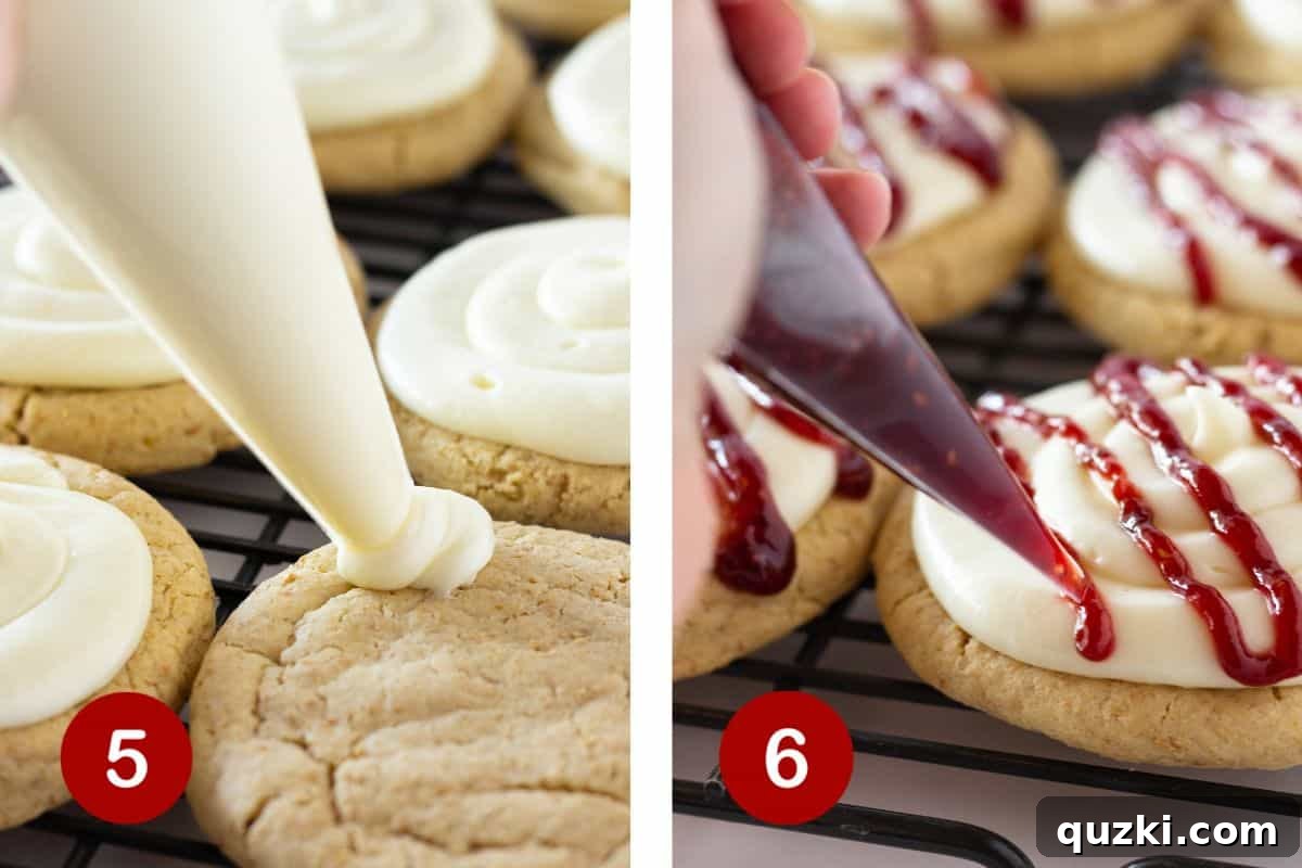 The delicious conclusion: Cheesecake frosting perfectly piped on cookies, followed by a beautiful raspberry jam drizzle.