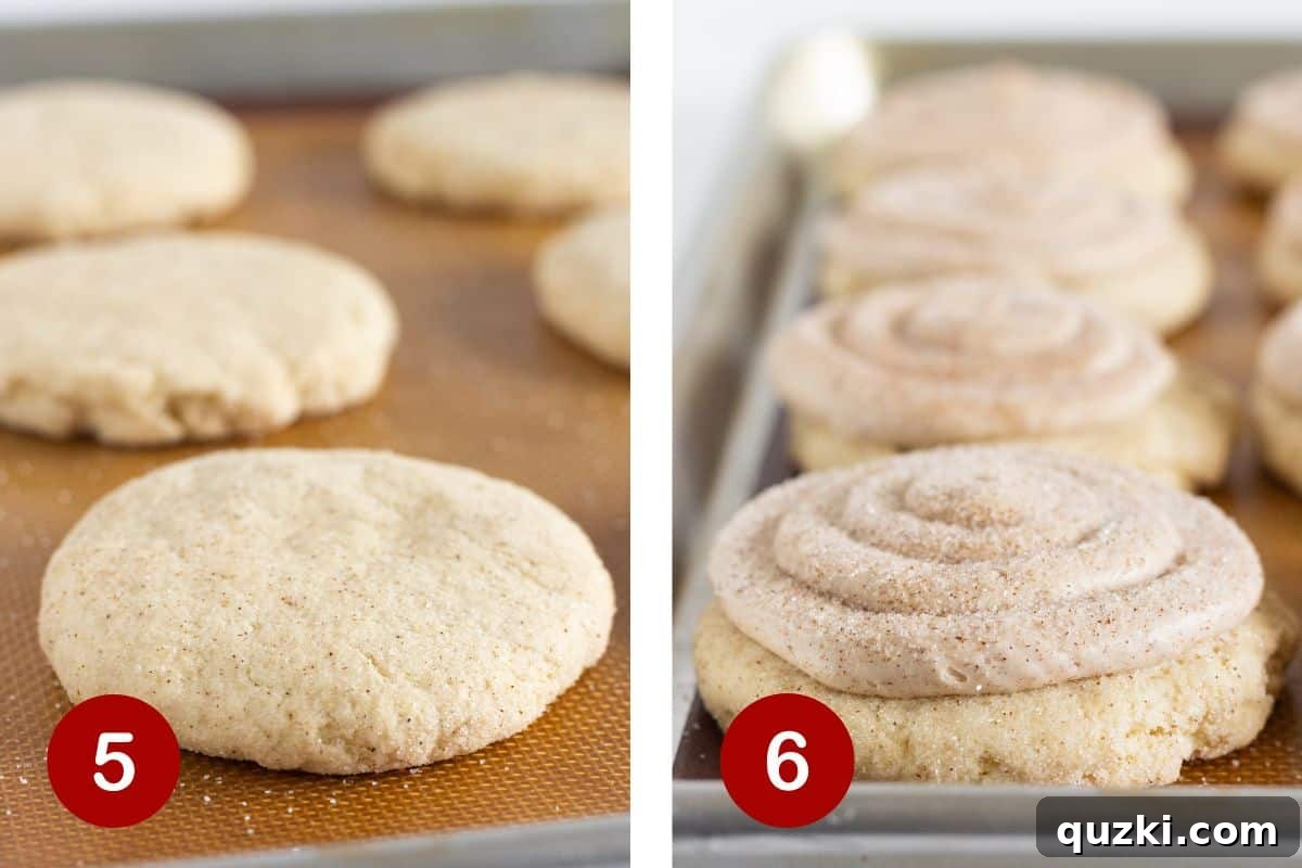 The final steps of making churro cookies: freshly baked cookies on a baking sheet and a piped cinnamon buttercream frosting being applied.