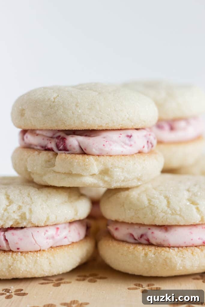 Pillowy Raspberry Cream Cheese Sandwich Cookies 2 Sugar Cookie Sandwiches with Raspberry Cream Cheese Frosting, by Top US cookie blog Practically Homemade
