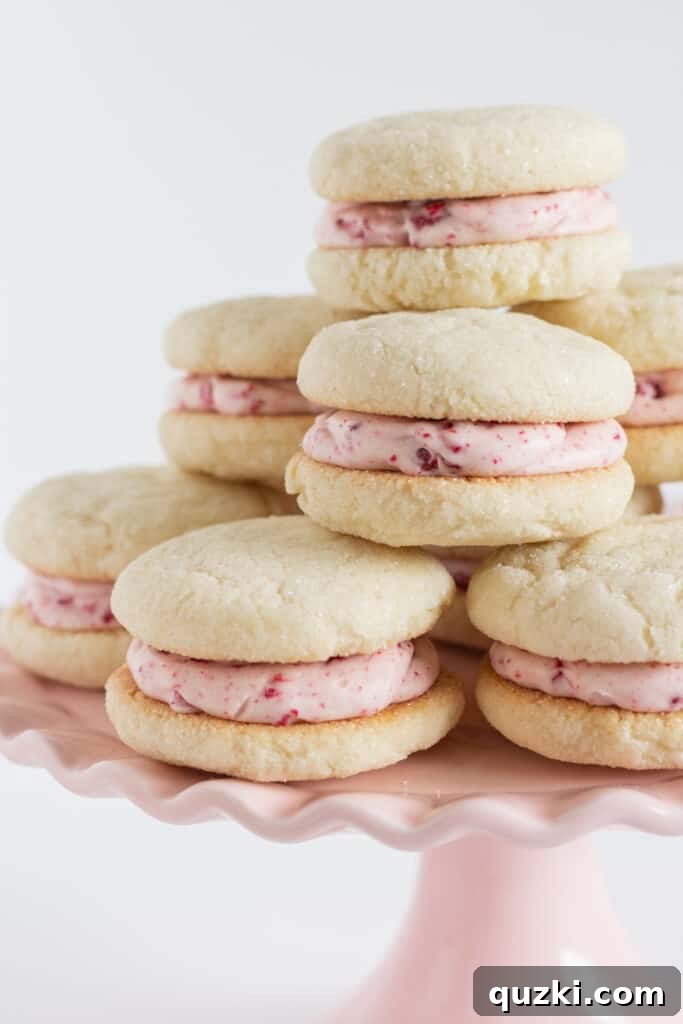 Pillowy Raspberry Cream Cheese Sandwich Cookies 3 Sugar Cookie Sandwiches with Raspberry Cream Cheese Frosting, by Top US cookie blog Practically Homemade
