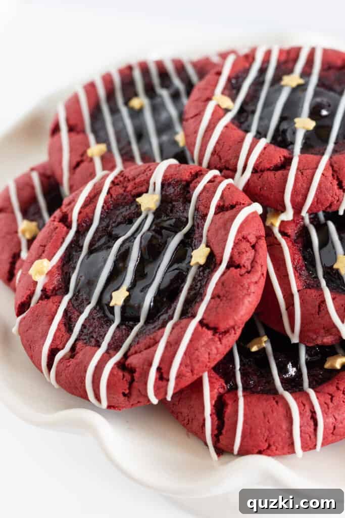 Red White and Blue Thumbprint Cookies, made from red velvet cake mix, filled with blueberry jam and white chocolate